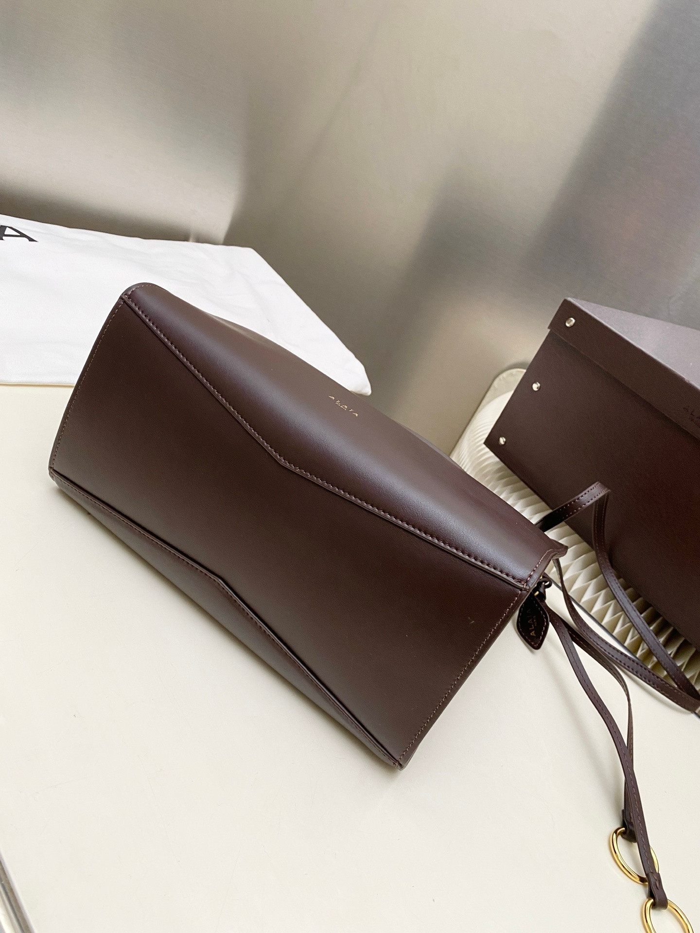 ALAÏA LE CLICK SQUARE BAG IN NUBUCK 26x14x24cm